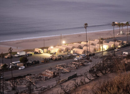 Members of the National Guard set up a beachfront camp across homes destroyed by the Palisades Fire in the Pacific Palisades neighborhood of Los Angeles, Thursday, Jan. 16, 2025. (AP Photo/Damian Dovarganes)