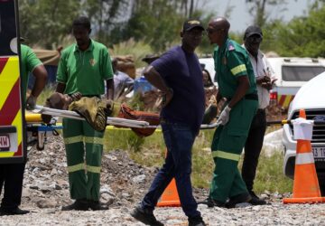 A miner is transported on a stretcher by rescue workers after he was rescued from below ground in an abandoned gold mine in Stilfontein, South Africa, Tuesday, Jan. 14, 2025. (AP Photo/Themba Hadebe)