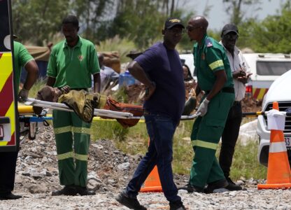 A miner is transported on a stretcher by rescue workers after he was rescued from below ground in an abandoned gold mine in Stilfontein, South Africa, Tuesday, Jan. 14, 2025. (AP Photo/Themba Hadebe)