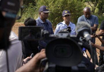 National police spokesperson Athlenda Mathe, speaks to journalist outside an abandoned gold mine, where miners are rescued from below ground, in Stilfontein, South Africa, Thursday, Jan. 16, 2025. (AP Photo/Themba Hadebe)