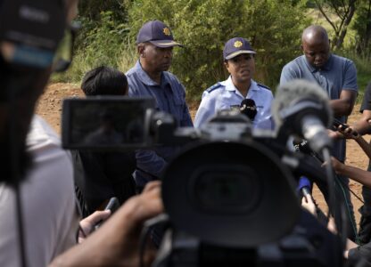 National police spokesperson Athlenda Mathe, speaks to journalist outside an abandoned gold mine, where miners are rescued from below ground, in Stilfontein, South Africa, Thursday, Jan. 16, 2025. (AP Photo/Themba Hadebe)