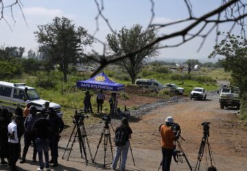 Journalists are seen during a stake-out at an abandoned gold mine, where miners were rescued from below ground, in Stilfontein, South Africa, Thursday, Jan. 16, 2025. (AP Photo/Themba Hadebe)