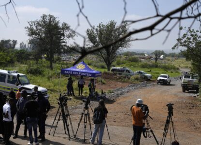 Journalists are seen during a stake-out at an abandoned gold mine, where miners were rescued from below ground, in Stilfontein, South Africa, Thursday, Jan. 16, 2025. (AP Photo/Themba Hadebe)