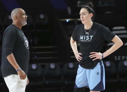 Mist player Breanna Stewart talks to head coach Phil Handy during a practice session, Thursday, Jan. 16, 2025, in Medley, Fla. (AP Photo/Marta Lavandier)