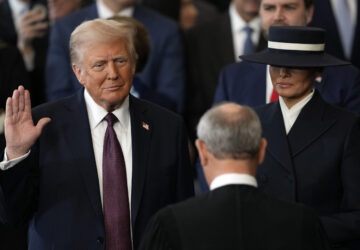 Donald Trump is sworn in as the 47th president of the United States by Chief Justice John Roberts as Melania Trump holds the Bible during the 60th Presidential Inauguration in the Rotunda of the U.S. Capitol in Washington, Monday, Jan. 20, 2025. (AP Photo/Julia Demaree Nikhinson, Pool)