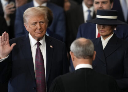 Donald Trump is sworn in as the 47th president of the United States by Chief Justice John Roberts as Melania Trump holds the Bible during the 60th Presidential Inauguration in the Rotunda of the U.S. Capitol in Washington, Monday, Jan. 20, 2025. (AP Photo/Julia Demaree Nikhinson, Pool)