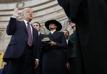 Donald Trump is sworn in as the 47th president of the United States by Chief Justice John Roberts as Melania Trump holds the Bible during the 60th Presidential Inauguration in the Rotunda of the U.S. Capitol in Washington, Monday, Jan. 20, 2025. (AP Photo/Morry Gash, Pool)