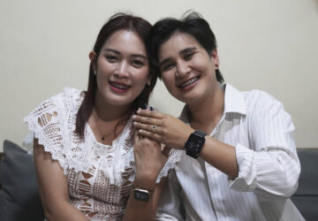 Sunma Piamboon, left, and her partner Danaya Phonphayung show their wedding ring in Bangkok, Thailand, on Jan. 13, 2025. (AP Photo/Sakchai Lalit)