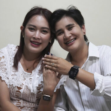 Sunma Piamboon, left, and her partner Danaya Phonphayung show their wedding ring in Bangkok, Thailand, on Jan. 13, 2025. (AP Photo/Sakchai Lalit)