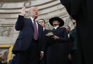 Donald Trump is sworn in as the 47th president of the United States by Chief Justice John Roberts as Melania Trump holds the Bible during the 60th Presidential Inauguration in the Rotunda of the U.S. Capitol in Washington, Monday, Jan. 20, 2025. (AP Photo/Morry Gash, Pool)