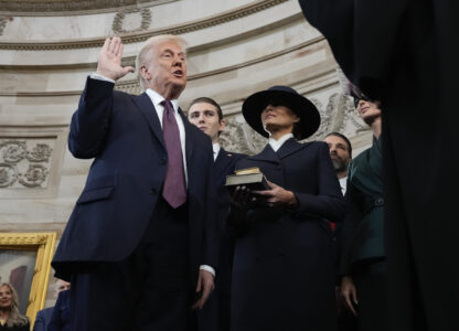 Donald Trump is sworn in as the 47th president of the United States by Chief Justice John Roberts as Melania Trump holds the Bible during the 60th Presidential Inauguration in the Rotunda of the U.S. Capitol in Washington, Monday, Jan. 20, 2025. (AP Photo/Morry Gash, Pool)