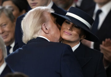 President Donald Trump kisses first lady Melania Trump during the 60th Presidential Inauguration in the Rotunda of the U.S. Capitol in Washington, Monday, Jan. 20, 2025. (AP Photo/Julia Demaree Nikhinson, Pool)