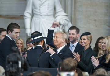 President Donald Trump, center, celebrates with Barron Trump, from left, Melania Trump, Eric Trump, Ivanka Trump and Tiffany Trump after being sworn in the 60th Presidential Inauguration in the Rotunda of the U.S. Capitol in Washington, Monday, Jan. 20, 2025. (Kenny Holston/The New York Times via AP, Pool)