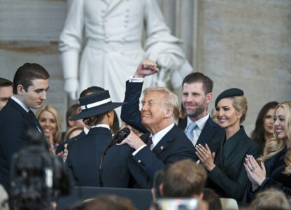 President Donald Trump, center, celebrates with Barron Trump, from left, Melania Trump, Eric Trump, Ivanka Trump and Tiffany Trump after being sworn in the 60th Presidential Inauguration in the Rotunda of the U.S. Capitol in Washington, Monday, Jan. 20, 2025. (Kenny Holston/The New York Times via AP, Pool)