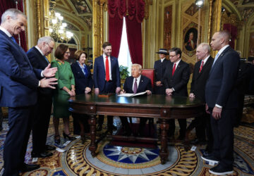 President Donald Trump, center, takes part in a signing ceremony in the President's Room after the 60th Presidential Inauguration, Monday, Jan. 20, 2025, at the U.S. Capitol in Washington. Surrounding the president are, from left, Senate Majority Leader Sen. John Thune, R-S.D.; Senate Minority Leader Chuck Schumer, D-N.Y.; Sen. Deb Fischer, R-Neb.; Sen. Amy Klobuchar, D-Minn.; Vice President JD Vance; first lady Melania Trump; House Speaker Mike Johnson, R-La.; House Majority Leader Steve Scalise, R-La.; and House Minority Leader Hakeem Jeffries, D-N.Y. (Melina Mara/The Washington Post via AP, Pool)