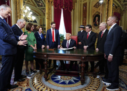 President Donald Trump, center, takes part in a signing ceremony in the President's Room after the 60th Presidential Inauguration, Monday, Jan. 20, 2025, at the U.S. Capitol in Washington. Surrounding the president are, from left, Senate Majority Leader Sen. John Thune, R-S.D.; Senate Minority Leader Chuck Schumer, D-N.Y.; Sen. Deb Fischer, R-Neb.; Sen. Amy Klobuchar, D-Minn.; Vice President JD Vance; first lady Melania Trump; House Speaker Mike Johnson, R-La.; House Majority Leader Steve Scalise, R-La.; and House Minority Leader Hakeem Jeffries, D-N.Y. (Melina Mara/The Washington Post via AP, Pool)