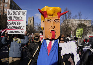 Protestors rally on Inauguration Day, Monday, Jan. 20, 2025, in Washington. (AP Photo/Jose Luis Magana)