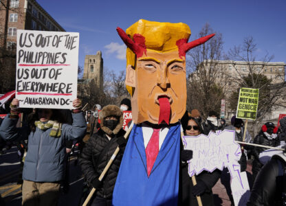 Protestors rally on Inauguration Day, Monday, Jan. 20, 2025, in Washington. (AP Photo/Jose Luis Magana)