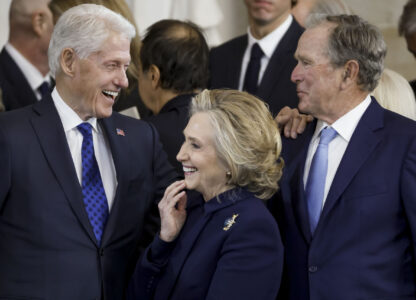 From left, former President Bill Clinton, former Secretary of State Hillary Clinton, and former President George W. Bush, speak following the 60th Presidential Inauguration for President Donald Trump, in the Rotunda of the U.S. Capitol in Washington, Monday, Jan. 20, 2025. (Shawn Thew/Pool photo via AP)