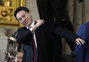 CORRECTS ID TO TIKTOK CEO - TikTok CEO Shou Chew puts on his coat after the 60th Presidential Inauguration in the Rotunda of the U.S. Capitol in Washington, Monday, Jan. 20, 2025. (AP Photo/Julia Demaree Nikhinson, Pool)