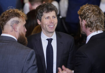 Open AI CEO Sam Altman, center, speaks with boxer Jake Paul and wrestler Logan Paul in Emancipation Hall at the 60th Presidential Inauguration, Monday, Jan. 20, 2025, at the U.S. Capitol in Washington. (Al Drago/Pool Photo via AP)