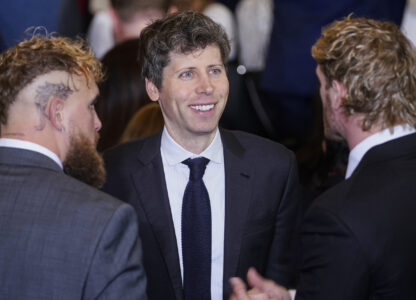 Open AI CEO Sam Altman, center, speaks with boxer Jake Paul and wrestler Logan Paul in Emancipation Hall at the 60th Presidential Inauguration, Monday, Jan. 20, 2025, at the U.S. Capitol in Washington. (Al Drago/Pool Photo via AP)