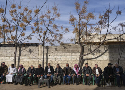 Local officials hold a meeting with the new Syrian security forces, in Nawa, near Daraa, Syria, Jan. 4, 2025. (AP Photo/Mosa'ab Elshamy)