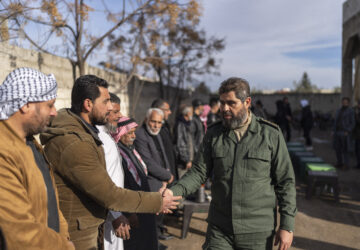 Southern rebel commander Ahmad al-Awda meets with local officials, in Nawa, near Daraa, Syria, Jan. 4, 2025. (AP Photo/Mosa'ab Elshamy)