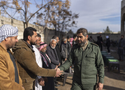 Southern rebel commander Ahmad al-Awda meets with local officials, in Nawa, near Daraa, Syria, Jan. 4, 2025. (AP Photo/Mosa'ab Elshamy)