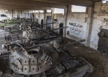 Tanks that belonged to the Assad government sit parked in a warehouse, in Nawa, near Daraa, Syria, Jan. 4, 2025. (AP Photo/Mosa'ab Elshamy)