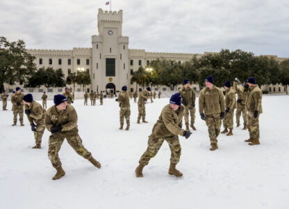 Citadel cadets engage in a snowball fight during a very rare snow day to their campus on Wednesday Jan. 22, 2025 in Charleston, S.C. (Ed Wray/The Citadel via AP)