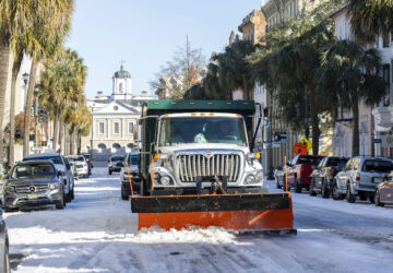 A City of Charleston snowplow clears Broad Street after a winter storm dropped ice and snow Wednesday, Jan. 22, 2025, on Charleston, S.C. (AP Photo/Mic Smith)