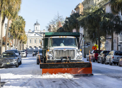 A City of Charleston snowplow clears Broad Street after a winter storm dropped ice and snow Wednesday, Jan. 22, 2025, on Charleston, S.C. (AP Photo/Mic Smith)