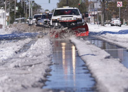 Snowplows clear snow from Jefferson Highway the day after a rare and record setting snowstorm in River Ridge, La., a suburb of New Orleans, Wednesday, Jan. 22, 2025. (AP Photo/Gerald Herbert)