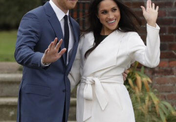 FILE -Britain's Prince Harry and his fiancee Meghan Markle pose for photographers during a photocall in the grounds of Kensington Palace in London, Nov. 27, 2017. (AP Photo/Matt Dunham, File)