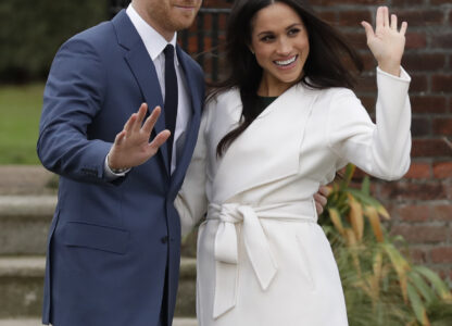 FILE -Britain's Prince Harry and his fiancee Meghan Markle pose for photographers during a photocall in the grounds of Kensington Palace in London, Nov. 27, 2017. (AP Photo/Matt Dunham, File)