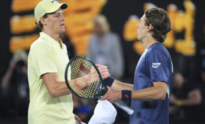 Jannik Sinner, left, of Italy is congratulated by Alex de Minaur of Australia following their quarterfinal match at the Australian Open tennis championship in Melbourne, Australia, Wednesday, Jan. 22, 2025. (AP Photo/Vincent Thian)