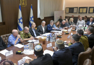 FILE - In this photo provided by the Israeli Government Press Office, Israeli Prime Minister Benjamin Netanyahu, center, meets with his security Cabinet to vote on a ceasefire deal that would pause the 15-month war with Hamas in Gaza, in Jerusalem, Jan. 17, 2025. (Koby Gideon/Israeli Government Press Office via AP, File)