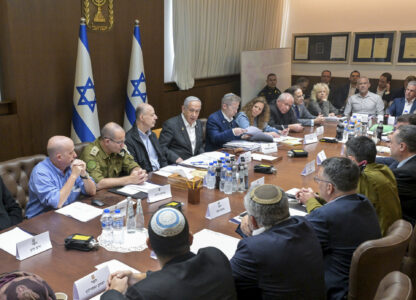 FILE - In this photo provided by the Israeli Government Press Office, Israeli Prime Minister Benjamin Netanyahu, center, meets with his security Cabinet to vote on a ceasefire deal that would pause the 15-month war with Hamas in Gaza, in Jerusalem, Jan. 17, 2025. (Koby Gideon/Israeli Government Press Office via AP, File)