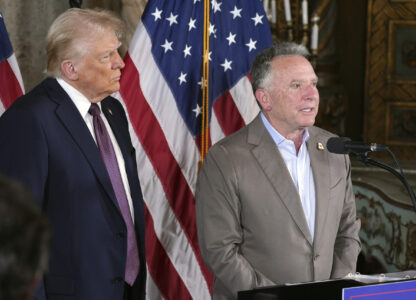 FILE - President-elect Donald Trump listens to Steve Witkoff speak during a news conference at Mar-a-Lago, Jan. 7, 2025, in Palm Beach, Fla. (AP Photo/Evan Vucci, File)