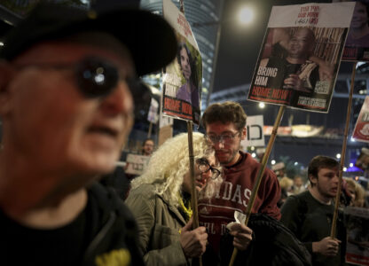 FILE - Friends and relatives of the hostages abducted by Hamas react to the ceasefire announcement during a demonstration in Tel Aviv, Israel, Jan. 15, 2025. (AP Photo/Oded Balilty, File)