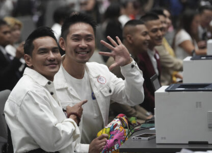 A couple from the LGBTQ+ community wait to sign their marriage certificates as the Marriage Equality Act takes effect in Bangkok, Thailand, Thursday, Jan. 23, 2025. (AP Photo/Sakchai Lalit)