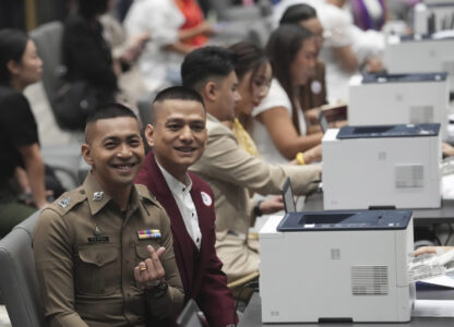 A couple from the LGBTQ+ community pose for a photo while waiting to sign their marriage certificates as the Marriage Equality Act takes effect in Bangkok, Thailand, Thursday, Jan. 23, 2025. (AP Photo/Sakchai Lalit)