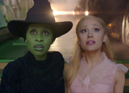 This image released by Universal Pictures shows Cynthia Erivo, left, and Ariana Grande in a scene from the film 