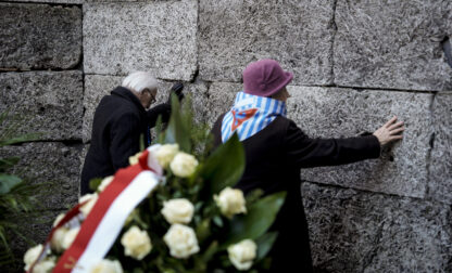 Survivors and relatives attend a ceremony at the Auschwitz-Birkenau former Nazi German concentration and extermination camp, in Oswiecim, Poland, Monday, Jan. 27. 2025.(AP Photo/Oded Balilty)