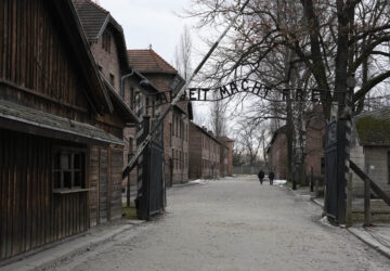 People visit the Memorial and Museum Auschwitz-Birkenau, a former Nazi German concentration and extermination camp, in Oswiecim, Poland, Sunday, Jan. 26, 2025. (AP Photo/Czarek Sokolowski)