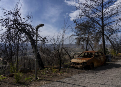 A scorched car and burnt trees damaged from the 14-month war between Hezbollah and Israel in Kibbutz Manara, on the border with Lebanon, northern Israel, Jan. 5, 2025. (AP Photo/Ariel Schalit)