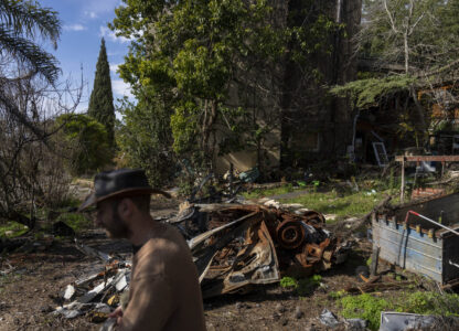 Igor Abramovich surveys heavy damage to a house from the 14-month war between Hezbollah and Israel in Kibbutz Manara, on the border with Lebanon, northern Israel, Jan. 5, 2025. (AP Photo/Ariel Schalit)