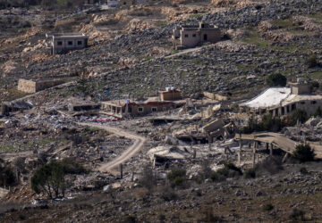 The heavy damage from the 14-month war between Hezbollah and Israel in southern Lebanon village of Meiss el-Jabal can be seen from a house in Kibbutz Manara, on the border with Lebanon, in northern Israel, Jan. 5, 2025. (AP Photo/Ariel Schalit)