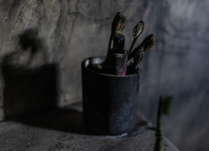 Tooth brushes left by a displaced family are seen burnt in their house heavily damaged from the 14-month war between Hezbollah and Israel in Kibbutz Manara, on the border with Lebanon, northern Israel, Jan. 5, 2025. (AP Photo/Ariel Schalit)